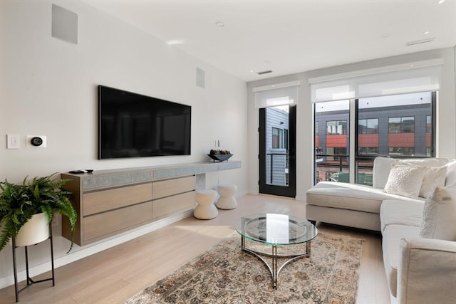 living room with light hardwood / wood-style floors