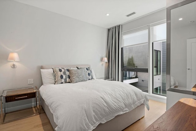 bedroom with light hardwood / wood-style flooring