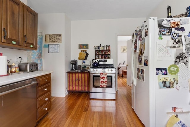 50-52 Chilton St, Cambridge, MA 02138 - kitchen with appliances with stainless steel finishes, light wood-type flooring, and light countertops