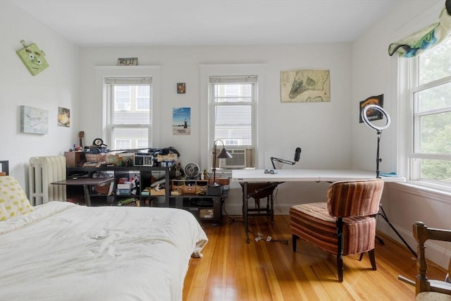 50-52 Chilton St, Cambridge, MA 02138 - bedroom featuring radiator, hardwood / wood-style floors, and cooling unit