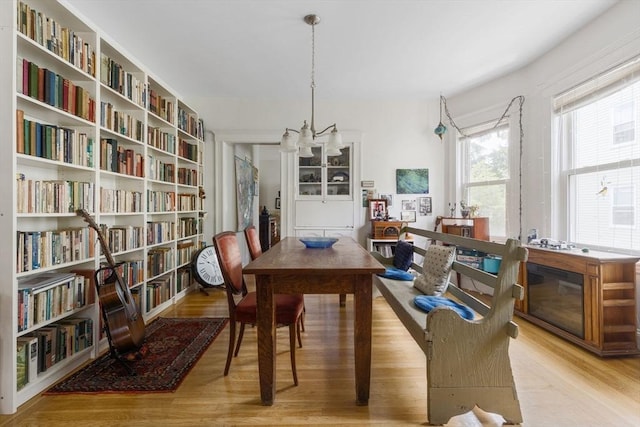 50-52 Chilton St, Cambridge, MA 02138 - dining room with wood finished floors and a chandelier