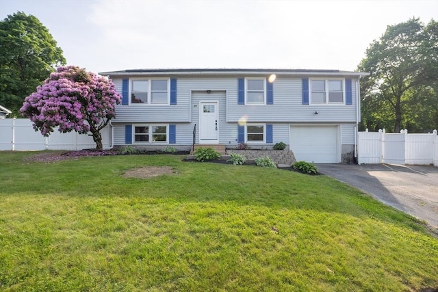 67 Paris Ave, Worcester, MA 01603 - split foyer home with asphalt driveway and a garage