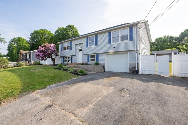 67 Paris Ave, Worcester, MA 01603 - bi-level home featuring driveway and an attached garage