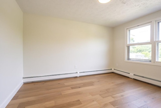 67 Paris Ave, Worcester, MA 01603 - spare room featuring light wood-type flooring, a textured ceiling, and baseboards