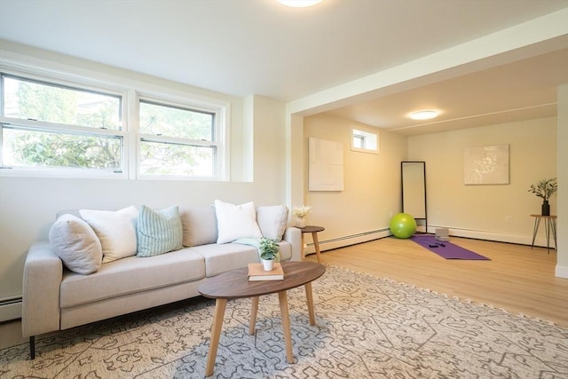 67 Paris Ave, Worcester, MA 01603 - living room with baseboard heating, wood finished floors, a baseboard radiator, and baseboards