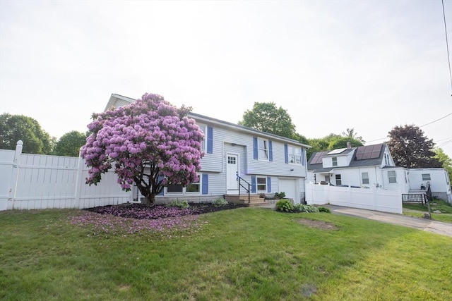 67 Paris Ave, Worcester, MA 01603 - split foyer home featuring a garage and concrete driveway