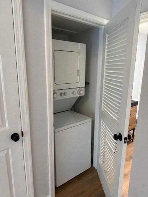 100 Cass Ave Unit B20, Dracut, MA 01826 - washroom with stacked washer and clothes dryer and wood finished floors