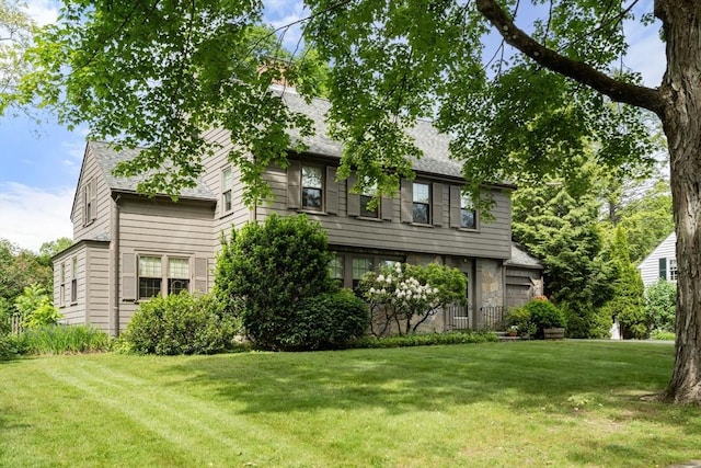 20 Johnson Rd, Andover, MA 01810 - view of front of home featuring a front lawn, roof with shingles, and stone siding