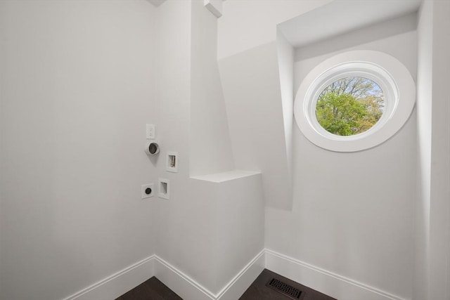 laundry area featuring laundry area, visible vents, baseboards, electric dryer hookup, and washer hookup