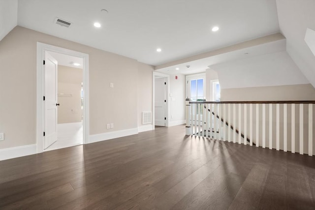 additional living space featuring visible vents, recessed lighting, baseboards, and wood finished floors