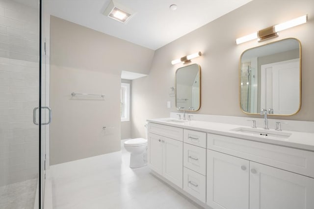 full bath with double vanity, a sink, toilet, and a shower stall