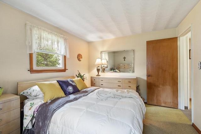 bedroom featuring light colored carpet