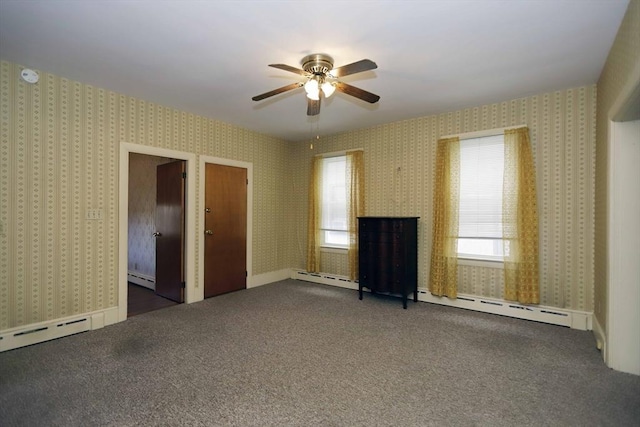 interior space with dark carpet, ceiling fan, and baseboard heating