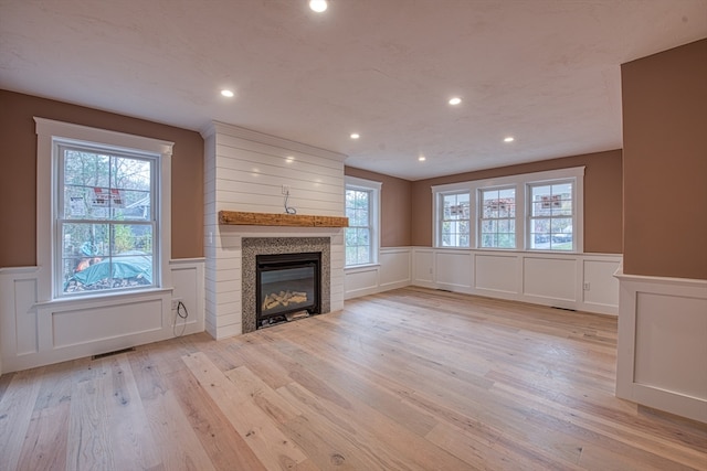 unfurnished living room with light wood-type flooring