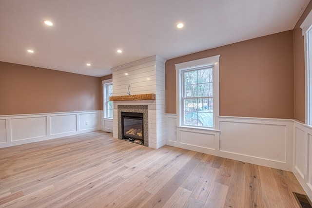 unfurnished living room featuring light hardwood / wood-style flooring