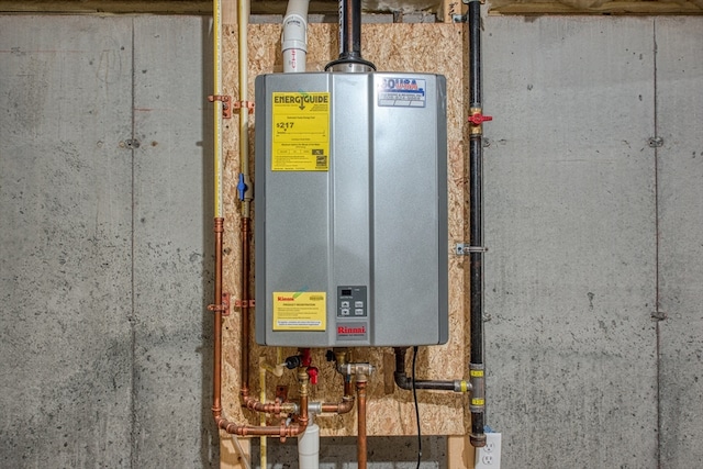 utility room featuring tankless water heater