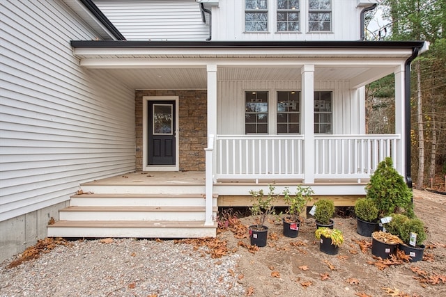 doorway to property featuring a porch