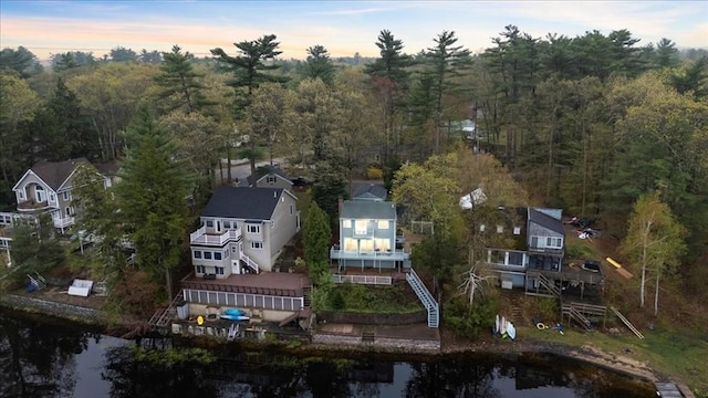 aerial view of property's location with a nearby body of water
