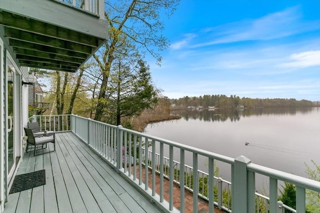 wooden deck with a water view