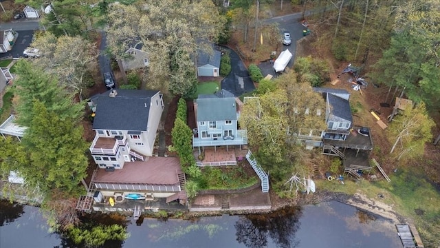 aerial view of property and surrounding area featuring a nearby body of water