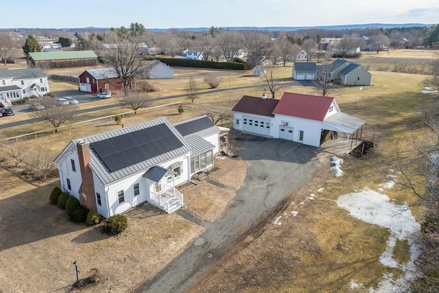 birds eye view of property featuring a rural view