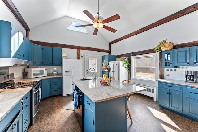 kitchen featuring white appliances, radiator heating unit, a sink, blue cabinets, and a wealth of natural light