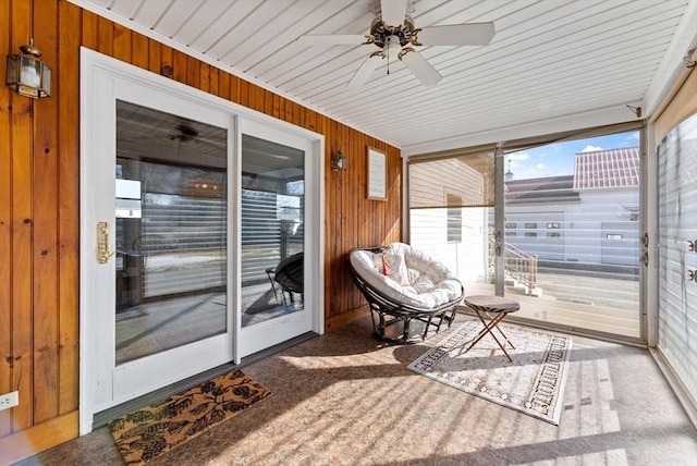 sunroom / solarium featuring ceiling fan