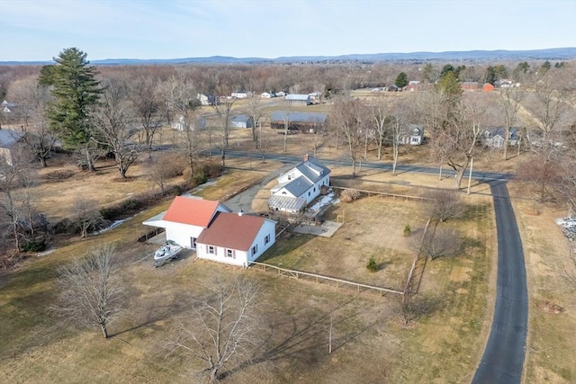 birds eye view of property with a rural view