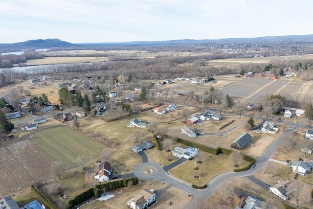 drone / aerial view featuring a rural view and a mountain view