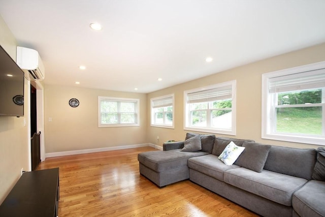215 Alida Rd, Braintree, MA 02184 - living area featuring light wood-type flooring, a wall mounted air conditioner, and recessed lighting