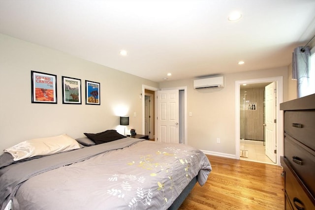 215 Alida Rd, Braintree, MA 02184 - bedroom with a wall mounted AC, light wood-style flooring, recessed lighting, and ensuite bathroom