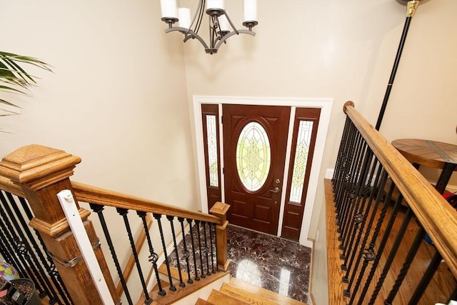 215 Alida Rd, Braintree, MA 02184 - foyer with a chandelier, marble tiled flooring, and stairs