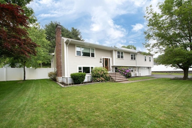 215 Alida Rd, Braintree, MA 02184 - rear view of property with driveway, a chimney, and a garage