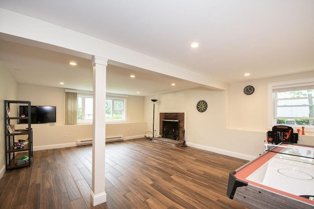 215 Alida Rd, Braintree, MA 02184 - playroom with dark wood finished floors, plenty of natural light, a baseboard heating unit, and recessed lighting