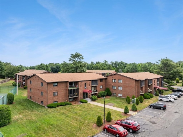 221 Oak St Unit 223, Brockton, MA 02302 - view of property featuring uncovered parking