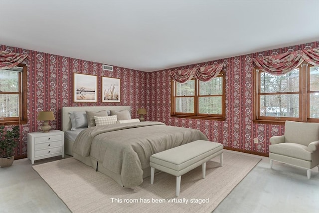 bedroom with carpet flooring, visible vents, baseboards, and wallpapered walls