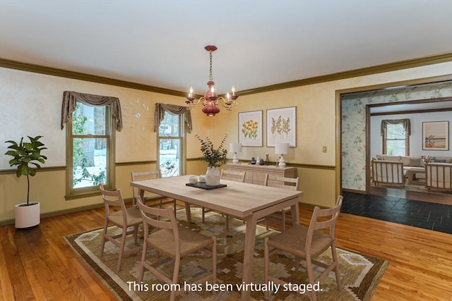 dining space featuring plenty of natural light, wood finished floors, and baseboards