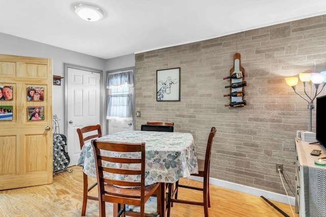 dining space with light hardwood / wood-style flooring