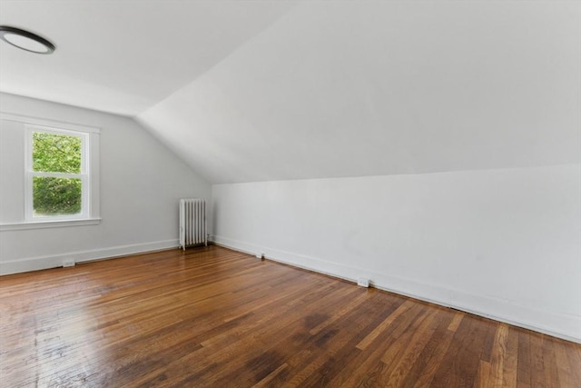 515 Front St, Weymouth, MA 02188 - bonus room with radiator, lofted ceiling, wood finished floors, and baseboards