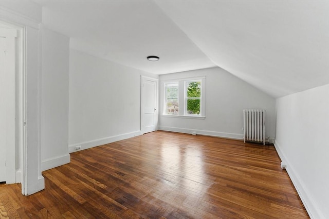 515 Front St, Weymouth, MA 02188 - additional living space with radiator heating unit, wood finished floors, vaulted ceiling, and baseboards