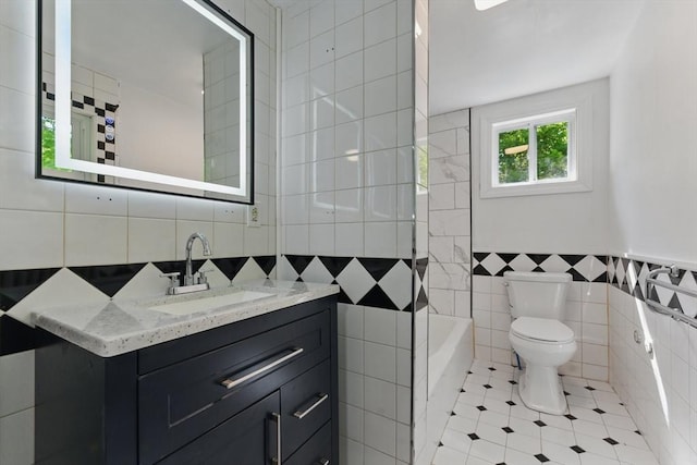 515 Front St, Weymouth, MA 02188 - full bathroom featuring tile walls, toilet, tile patterned flooring, and vanity