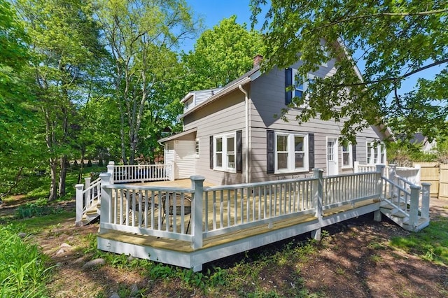 515 Front St, Weymouth, MA 02188 - rear view of property featuring a chimney and a wooden deck