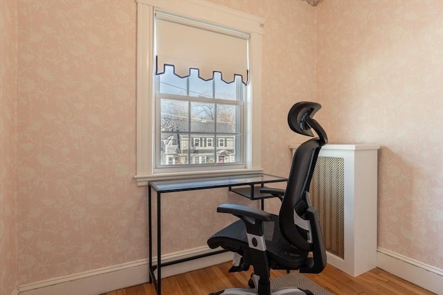 home office with hardwood / wood-style floors