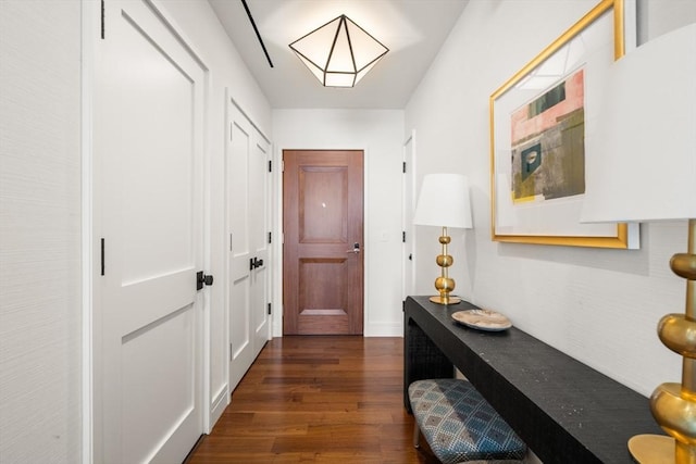 corridor with dark wood-type flooring