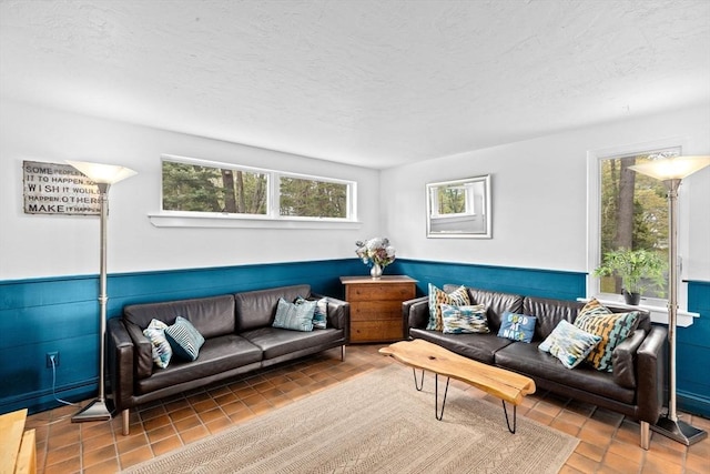 2 Cushing Lndg, Scituate, MA 02066 - living area with a wainscoted wall and a textured ceiling