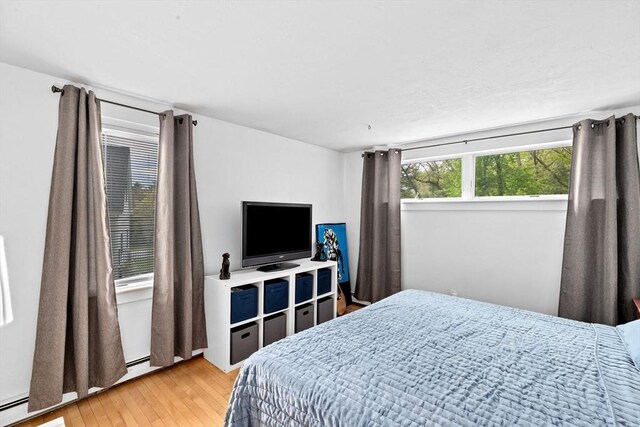 2 Cushing Lndg, Scituate, MA 02066 - bedroom featuring light wood-style floors and a baseboard radiator