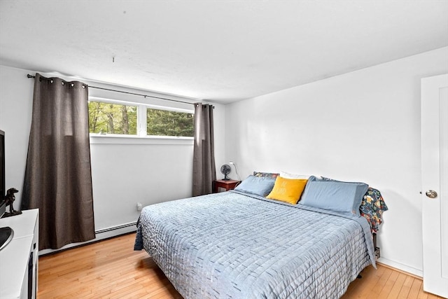2 Cushing Lndg, Scituate, MA 02066 - bedroom featuring light wood finished floors and baseboard heating