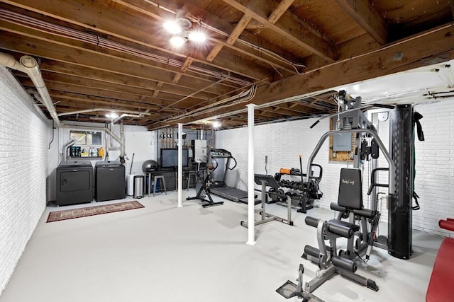 2 Cushing Lndg, Scituate, MA 02066 - exercise area featuring independent washer and dryer and brick wall