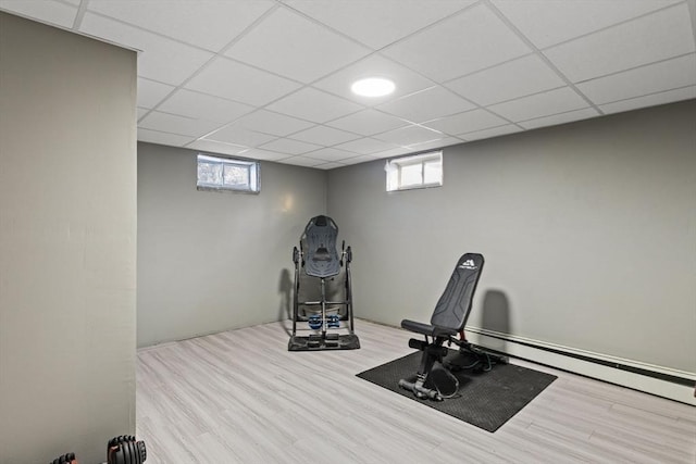 exercise room featuring light wood-type flooring