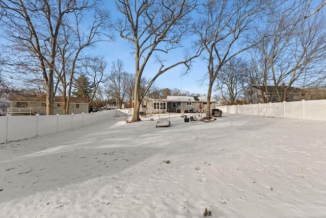 view of yard layered in snow